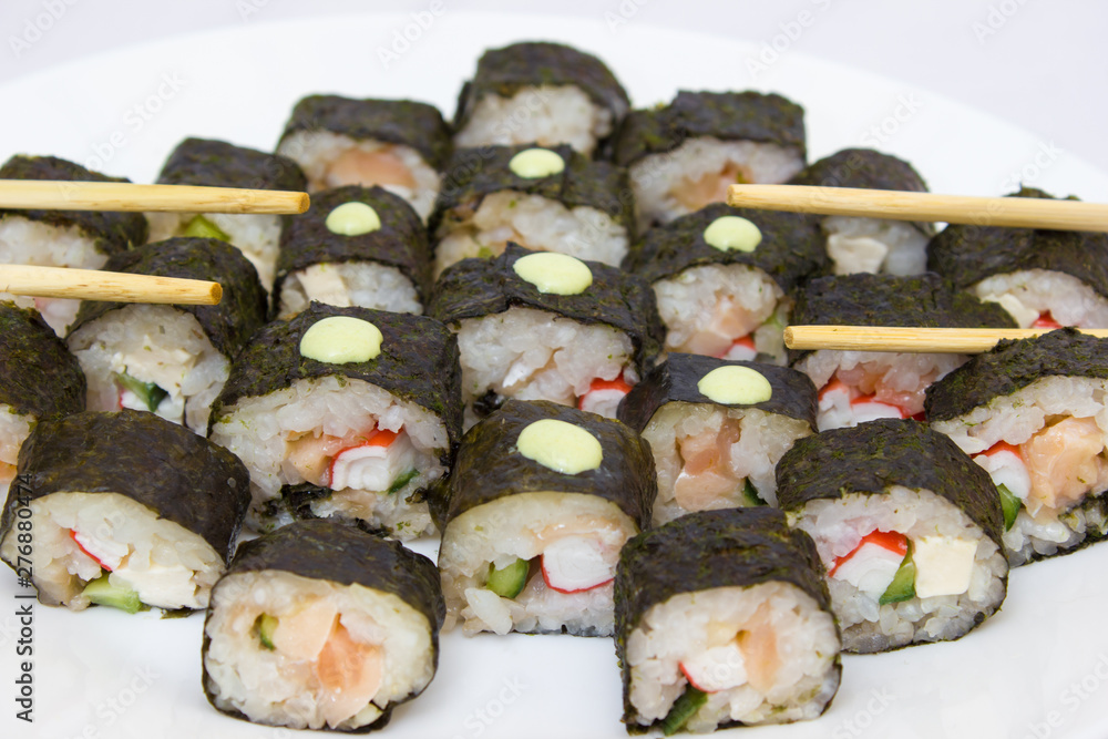 Japanese cuisine, rice sushi and fish - closeup Japanese cuisine, rice sushi and fish - closeup