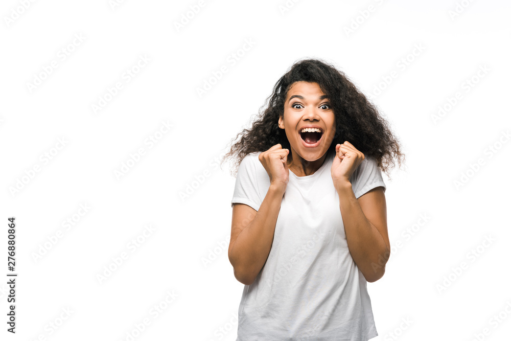 happy curly african american girl celebrating isolated on white