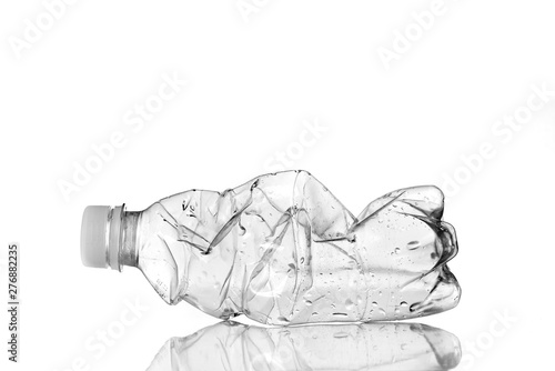 plastic bottle as garbage photographed with light studio on a totally white background