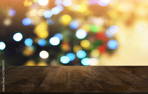 Empty dark wooden table in front of abstract blurred bokeh background of restaurant . can be used for display or montage your products.Mock up for space.