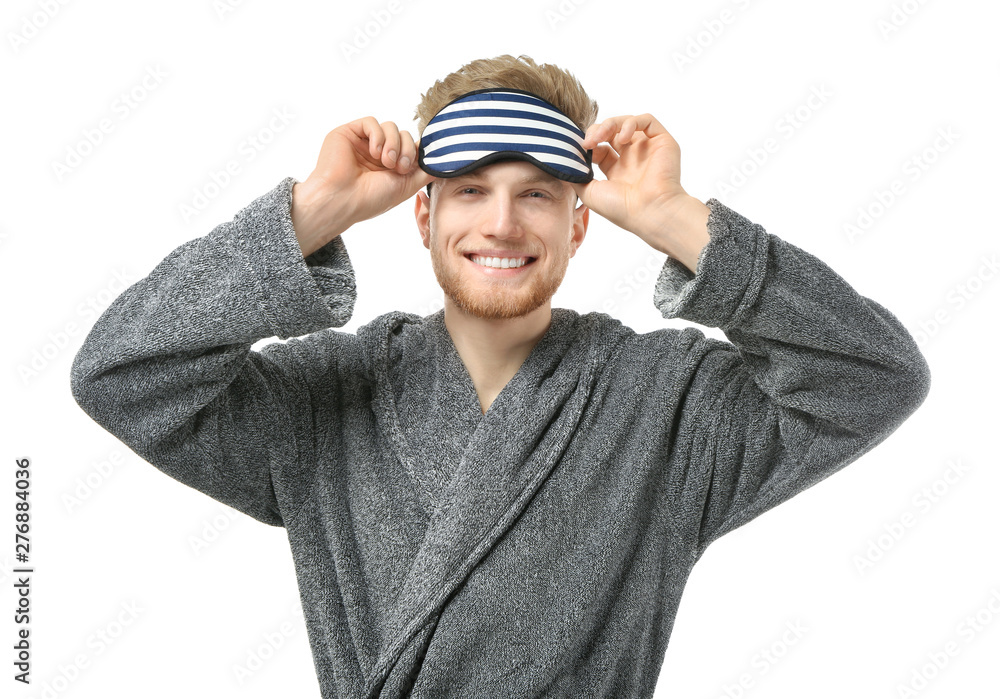 Handsome man with sleep mask on white background Handsome man with sleep mask on white background