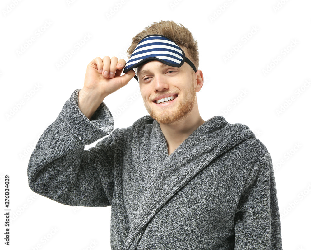 Handsome man with sleep mask on white background Handsome man with sleep mask on white background