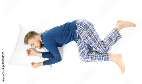 Handsome sleeping man on wh...