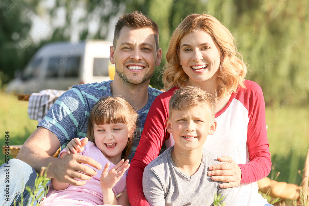 Happy family on summer picnic in park Happy family on summer picnic in park