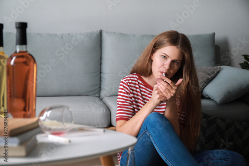 Young woman with addiction ...