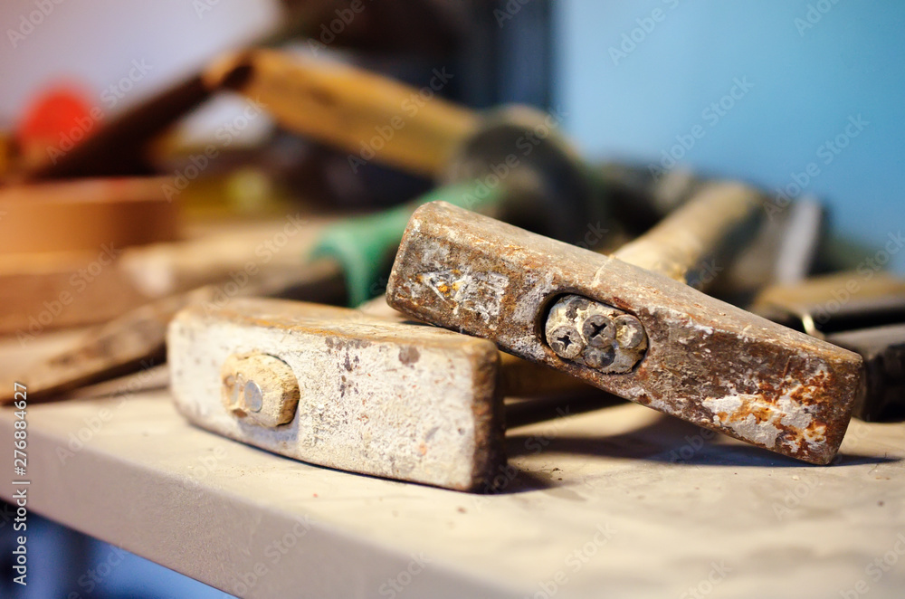 Old destroyed hammers among other hand tools Old destroyed hammers among other hand tools