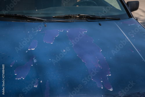Damage to the car's color due to poor quality in production.