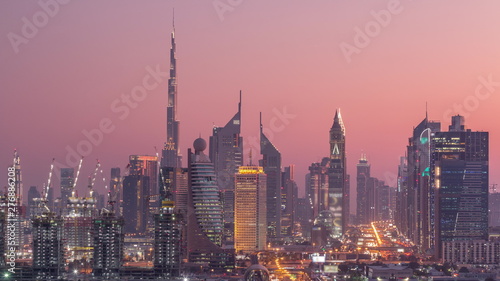 Dubai skyline after sunset with beautiful city center lights and Sheikh Zayed road traffic timelapse, Dubai, United Arab Emirates