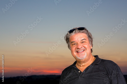 Man closeup portrait outdoors during twilight