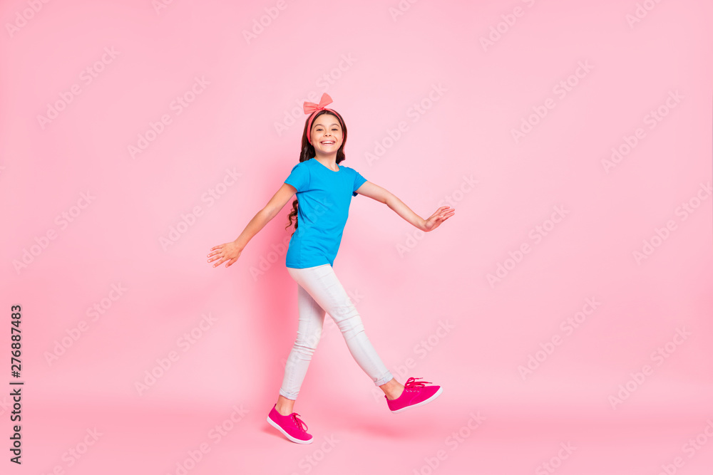 Full length body size view of her she nice attractive charming cute lovely cheerful cheery careless funny pre-teen girl having fun walking isolated on pink pastel background