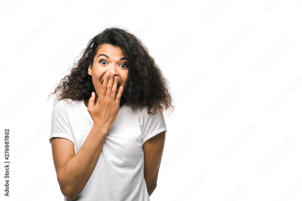 curly african american woman covering face with hand and looking at camera isolated on white curly african american woman covering face with hand and looking at camera isolated on white