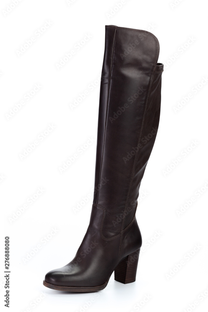 Woman high knee leather boots isolated on white background Woman high knee leather boots isolated on white background