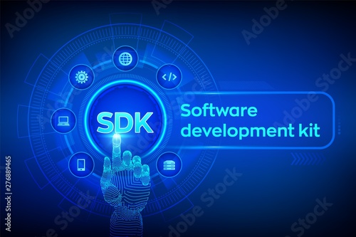 SDK. Software development kit programming language technology concept on virtual screen. Technology Concept. Robotic hand touching digital interface. Vector illustration. photo