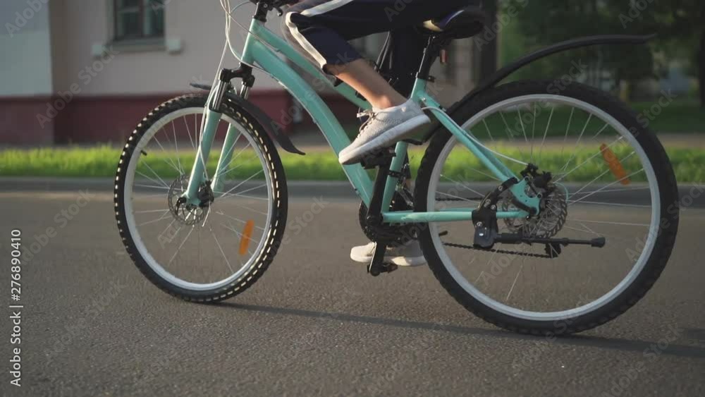 Child Girl Riding Bike at Sunset in Slow Motion Child Girl Riding Bike at Sunset in Slow Motion