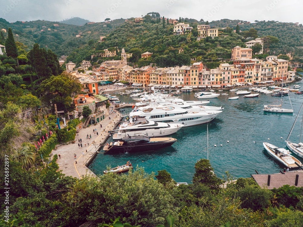 Portofino Liguria, colorful houses and yachts in the Bay, panorama of the city