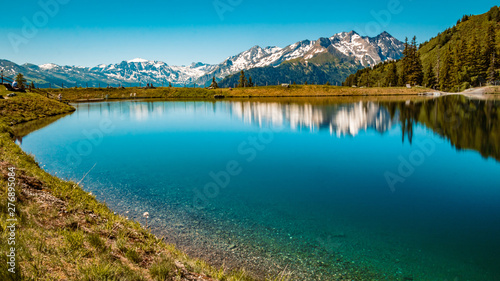 Beautiful alpine view and a lake with reflections taken with a ND grey filter at Rauris, Salzburg, Austria