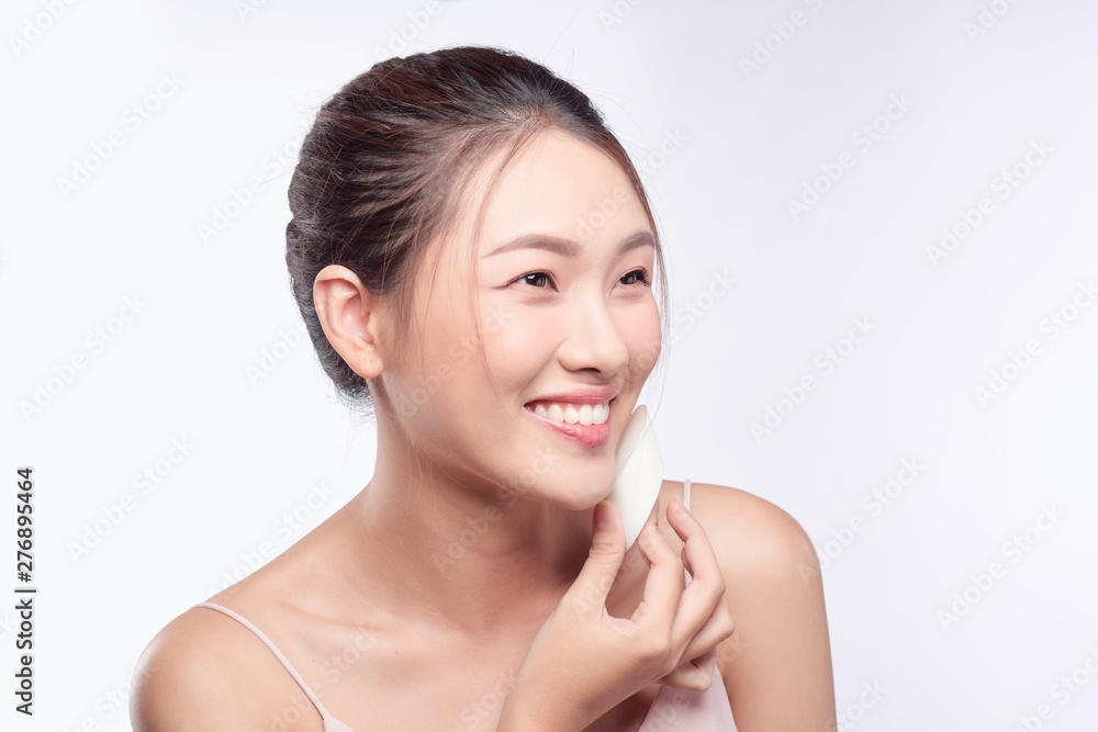 natural beautiful woman with powder puff on white background natural beautiful woman with powder puff on white background