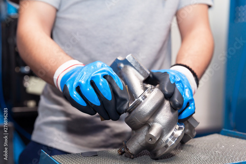 Obraz na płótnie Manual work in the automotive industry