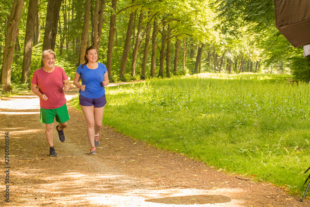 Couple share their session training while running Couple share their session training while running