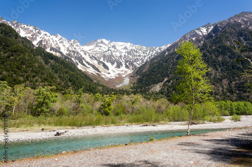 View on valley of Kamikochi, Chubu Sangaku National Park, Nagano, Japan. Beautiful surroundings in the Japan Alps for hiking, walking and to enjoy nature to the fullest. To be in harmony with nature. photo