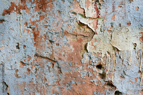 texture of old weathered grunge plaster cement wall with colorful paint © АliVa