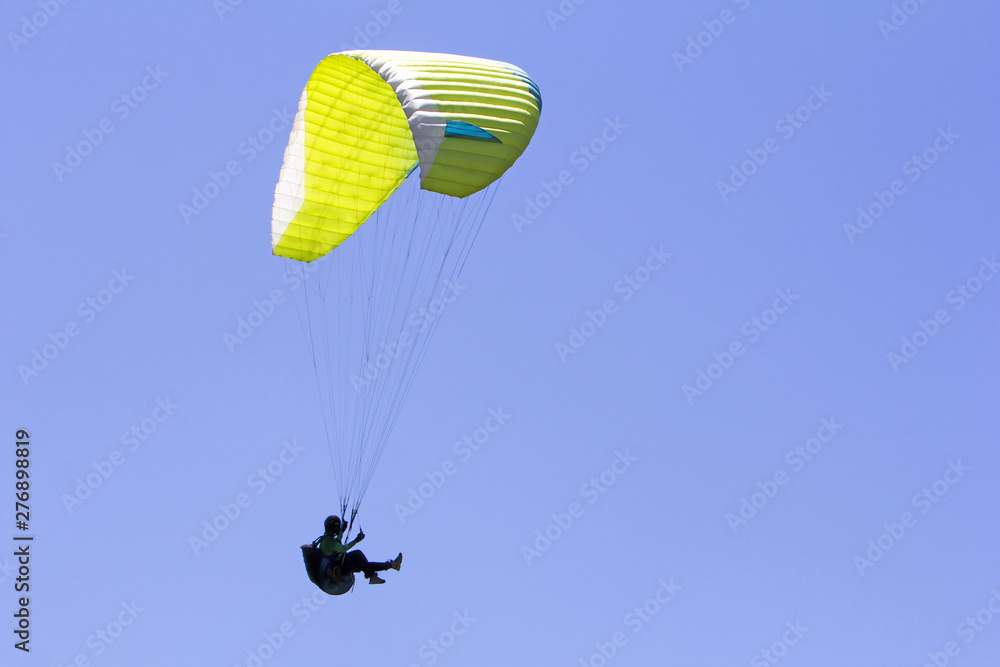 Paragliding in the blue sky as background extreme sport