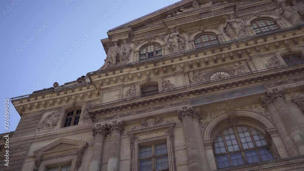 Left to right pan real time medium shot of Louvre in Paris Left to right pan real time medium shot of Louvre in Paris