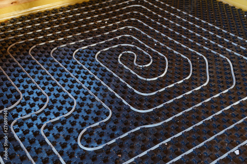 Canvas-taulu Underfloor heating pipes on black insulation plate