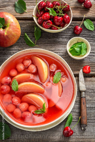 Delicious fruit soup with fresh apples and cherries