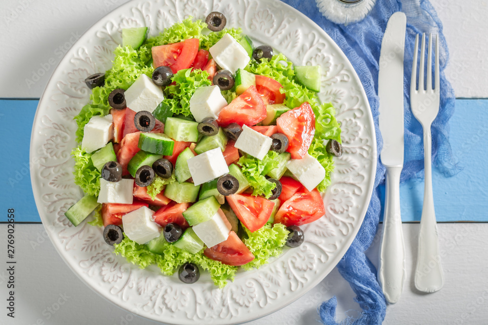 Fresh Greek salad with tomatoes, lettuce and feta cheese Fresh Greek salad with tomatoes, lettuce and feta cheese