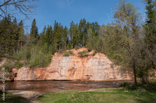 Red sandstone cliff at Gauja river, Latvia.