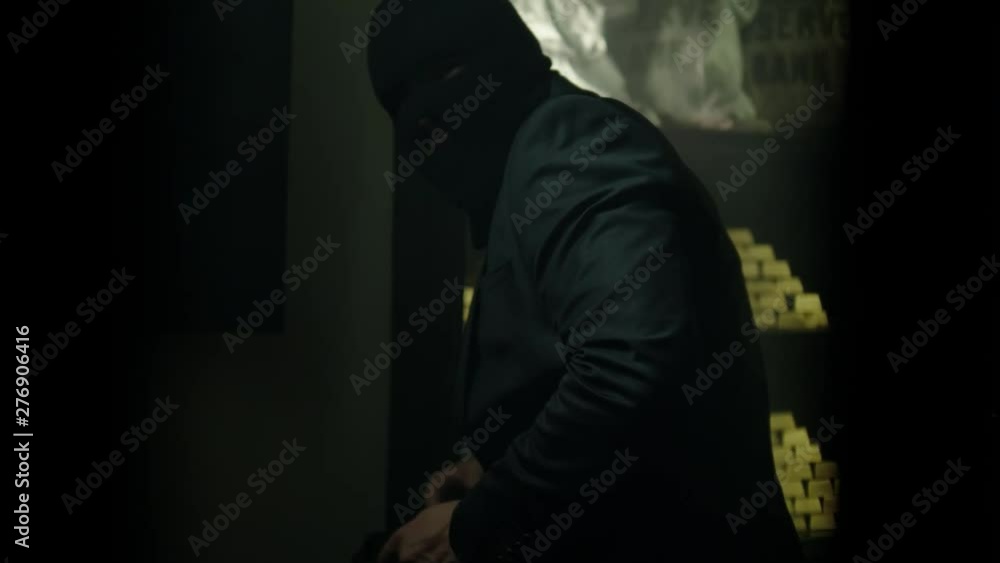 Man in mask robbing a bank