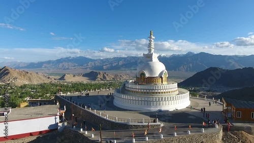 Shanti Stupa is a Buddhist white-domed stupa on a hilltop in Chanspa, Leh district, Ladakh, in the north Indian state of Jammu and Kashmir.  photo