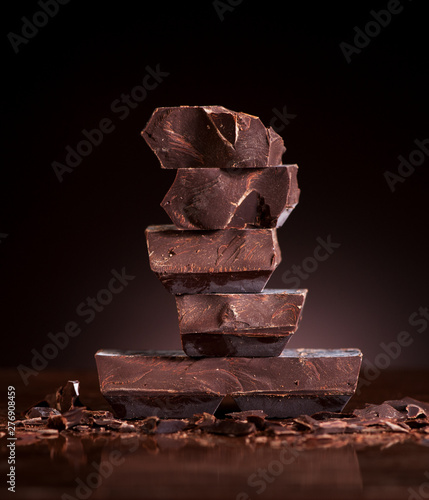 Chopped chocolate on a dark marble background