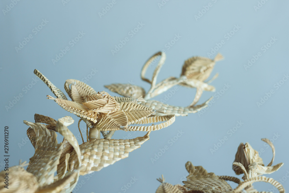 Fototapeta premium Decoration of straw. Branch with flowers. Decor. Fragment