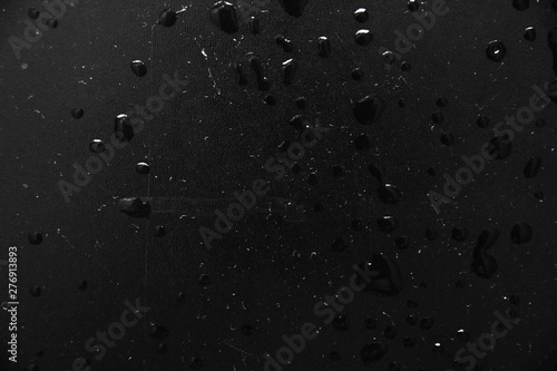 texture background water drops on a black background