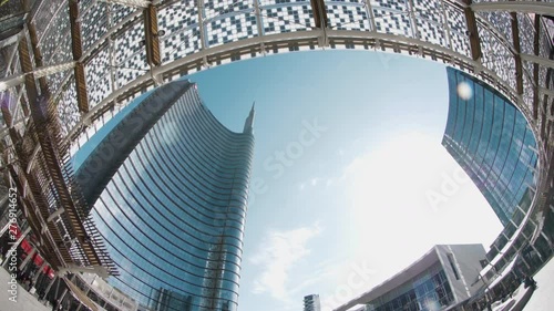 Milan city curved glass buildings in modern downtown business square. Italy