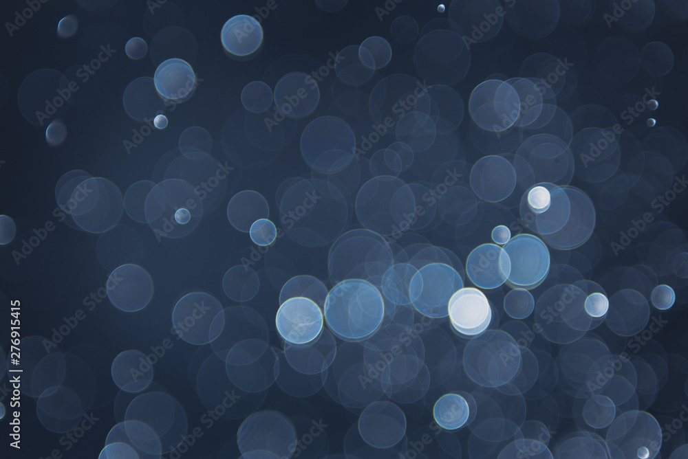 abstract sparkle bokeh light effect with navy blue background abstract sparkle bokeh light effect with navy blue background