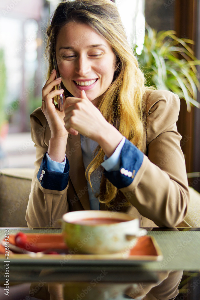 Happy smiling woman talking on the phone Happy smiling woman talking on the phone