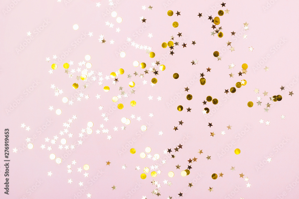 Gold Stars Glitter Confetti on pink background. Festive backdrop