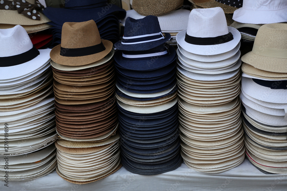 Mens hats laid out at the bazaar for sale