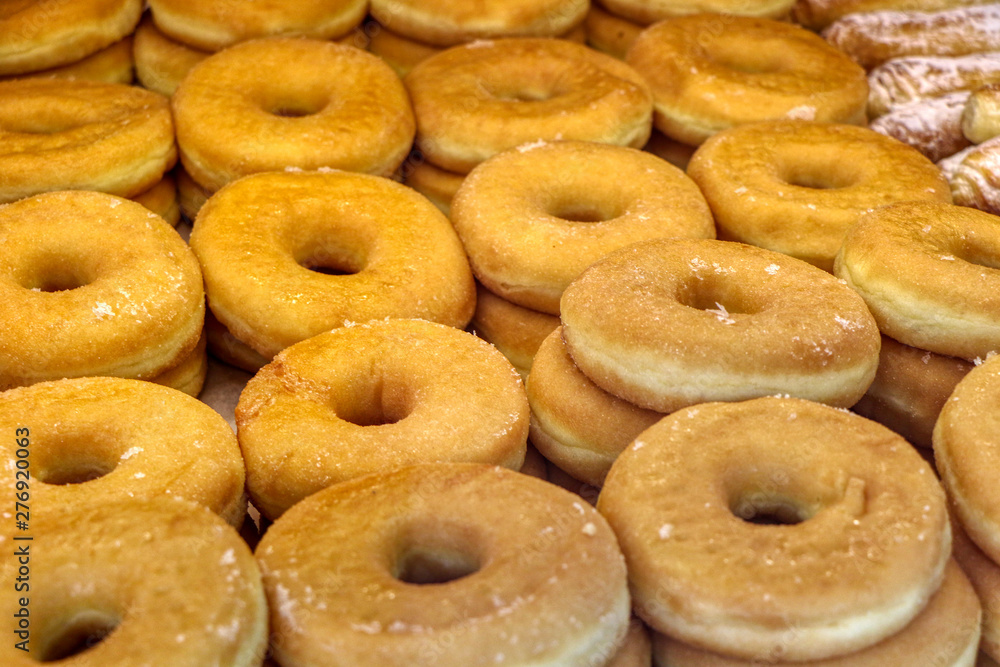 Berlinas, filled doughnuts ready to be sold in a pastry shop