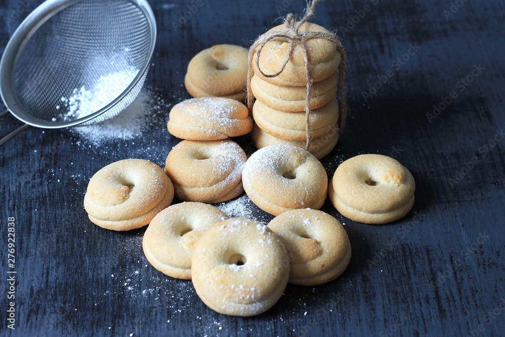 Homemade cookies tied with rope. Wooden background, close-up. Homemade cookies tied with rope. Wooden background, close-up.