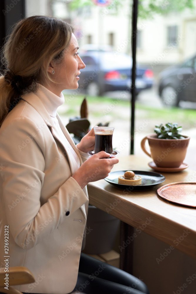 Happy young blonde woman in white suite Happy young blonde woman in white suite