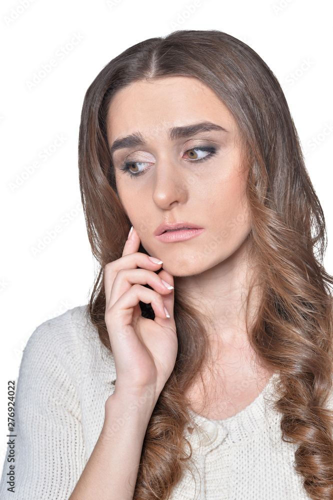 Beautiful sad woman posing isolated on white Beautiful sad woman posing isolated on white