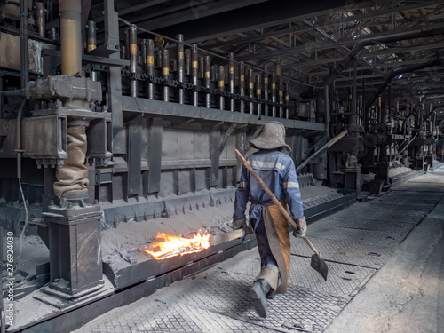 anodized aluminum electrolysis cells. fire worker. Aluminum plant. melting bucket. Safe environmental high-tech processes. Modern metallurgical plant. Melting furnace