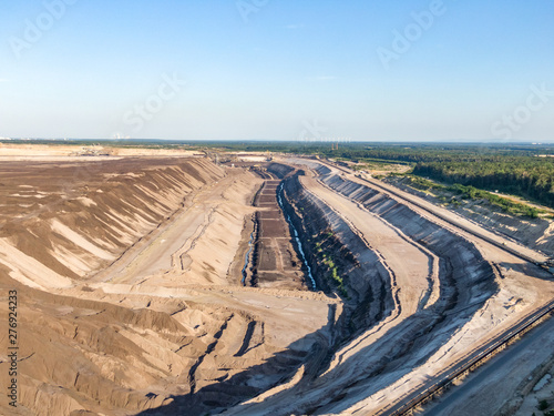 Aerial evening sunset view of Welzow Süd, one of the largest operational German open cast brown coal lignite mines near Cottbus in the state of Brandenburg. Germany will stop mining coal in 2038. photo