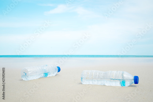 Waste plastic water bottles on the beach From humans destroying the environment. Help each other save the world from the problems of the surrounding environment.