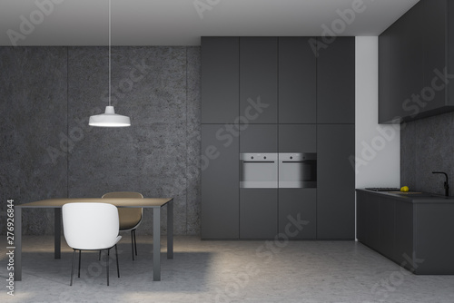 Gray and concrete kitchen with table