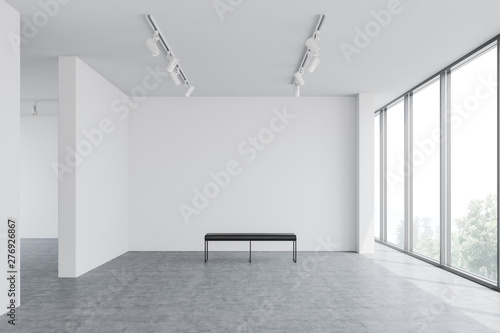 Empty white gallery interior with bench photo